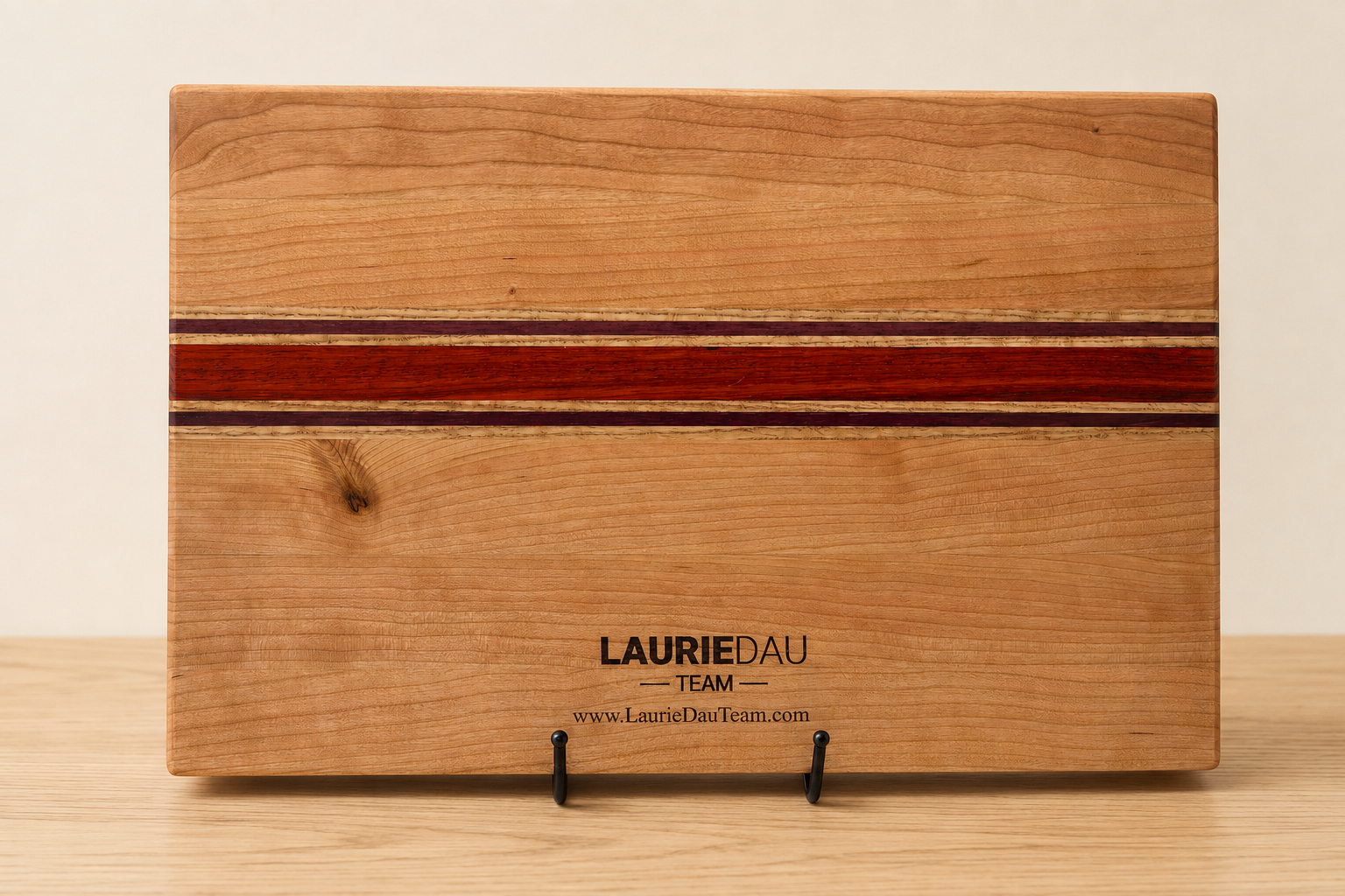 Laurie Dau Team Realtor branding engraved on the reverse of a hardwood board