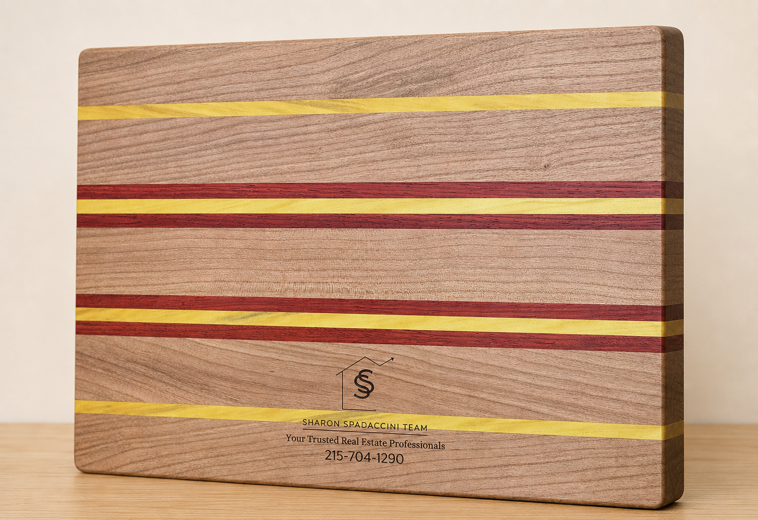 Sharon Spadaccini Team Realtor branding engraved on a hardwood board