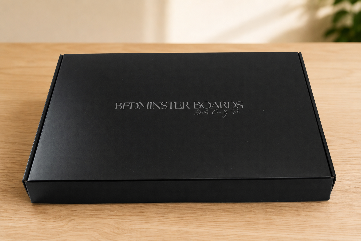 Closed black Bedminster Boards presentation box